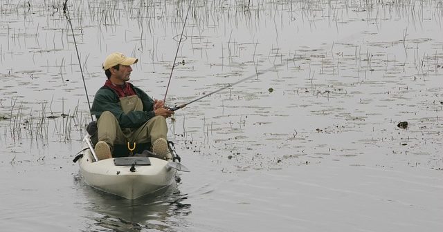 man fishing in sit on top kayak