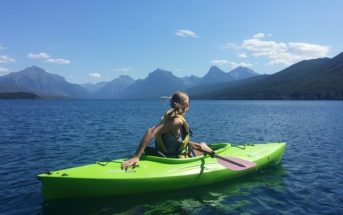 blong woman relaxes in kayak