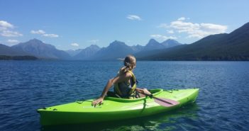 blong woman relaxes in kayak