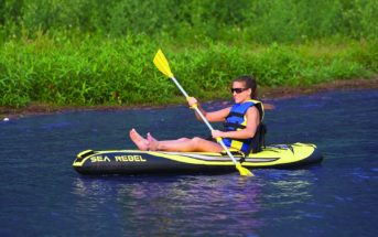 Rave inflatable kayak and female paddler